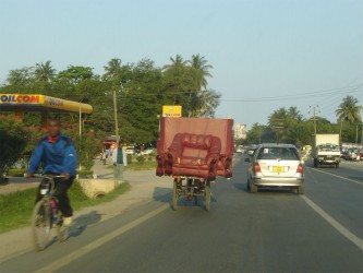 And no that is not me, but yes that is a 3 piece suite on the back of a bike!