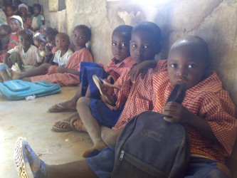 Before repairs, kids sit on crumbling cement