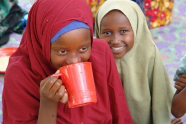 Girls in northern Kenya are provided with DFID-funded food aid. Credit: Amanda Rose