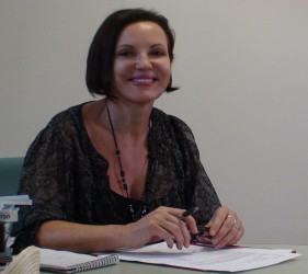 Elizabeth Carriere at desk