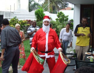 Keith MacKiggan, dressed as Father Christmas, having eaten well!