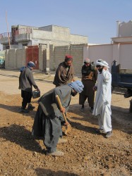 Local builders work on one of the roads in Lashkar Gah