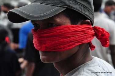 Photo: A protestor among the crowds in Kathmandu. Credit: Natalie de Oliveira