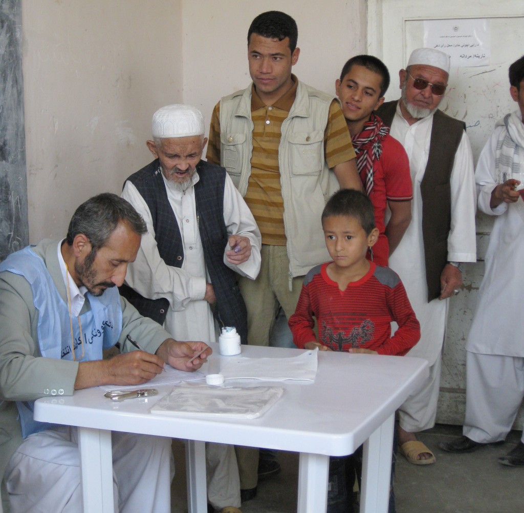 Photo of people voting at a polling station