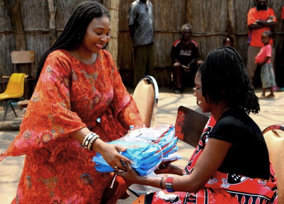 Picture: Yvonne gives out bednets