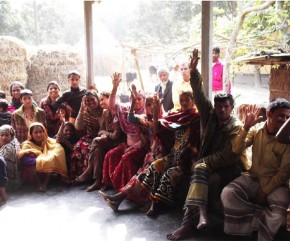 Members raising their hands to vote