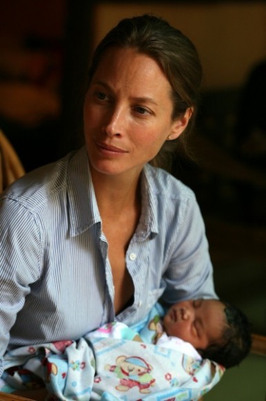 Christy holds a newborn baby