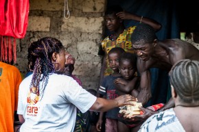 Distributing cholera prevention kits to families. Picture © CARE/Freccia Learson