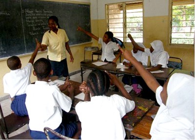 A primary school teacher answering questions in her class. Picture: Neema Kambona/DFID