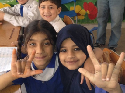 Children at the Deaf Reach School trying to teach me sign language. Picture: Asyia/DFID