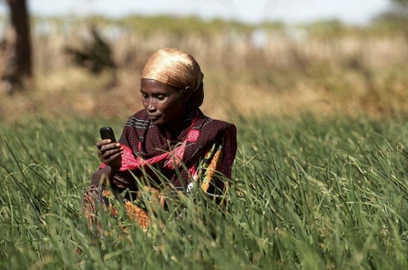 Hasha Kalcatcha, a 35 year old Borana woman, checks her mobile phone before deciding whether to harvest her crops. Picture: Piers Benatar/Panos