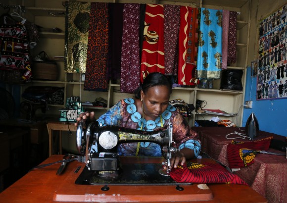 Stella Fanuel Mbisa works as a seamstress in a small shop selling garments in local markets and her shop. Ms Mbisa is supported by the UK and Comic Relief through the Gatsby trust, an organisation which provides vocational training for women.  Many of the women go on to start small and medium enterprises.