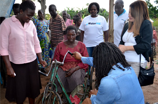 In Bobobe village, Uganda, Lynne Featherstone and Ade Adepitan met with Margaret - a disabled mother who gets around with the aid of her improvised wheelchair. Picture: James Kiyimba/WaterAid