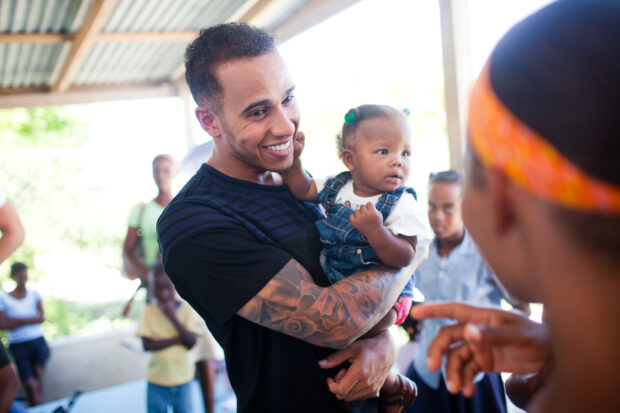 Louis Hamilton with Dorvilus Chelania and her malnurished child, Dinia, in Port-au-Prince, Haiti, Thursday, May 15, 2014.