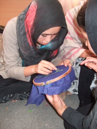 A young woman is trained in needlework. Picture: Zardozi