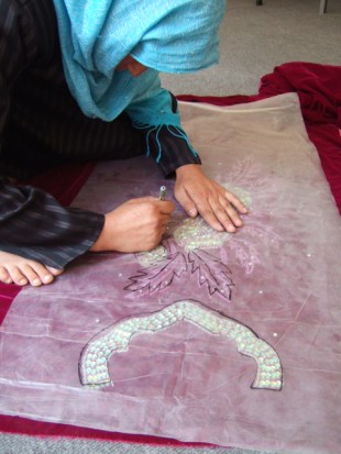 A woman hard at work. After a short training period – in tailoring and business skills – women are then encouraged to set up their own businesses. Picture: Zardozi