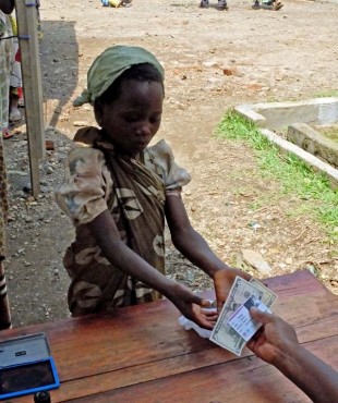 The cash is transferred. Picture: Chris Pycroft/DFID DRC