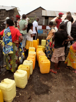 Queuing for water at the standpipe. Picture: Chris Pycroft/DFID.