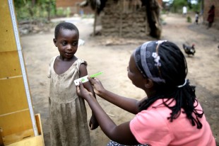 A young Tanzanian girl in Kunke village is checked for signs of malnutrition. Picture: Brian Sokol/IDRC/Panos