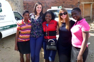 DFID Social Development Advisor Samantha Coope and I with 3 young HSCT beneficiaries at a pay point in Bulawayo. Picture: DFID