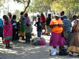 Rural paypoint: HSCT beneficiaries receiving their bimonthly cash payments earlier this month. Picture: Samantha Coope/DFID