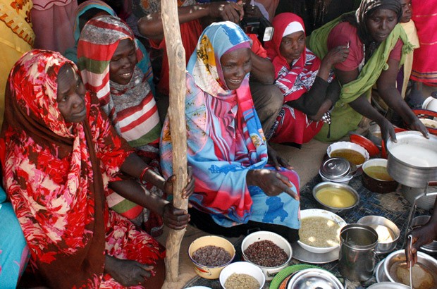 Women in the Ardamata IDP camp prepare sample meals with the vouchers they purchased. Picture: Vicky Seymour/DFID