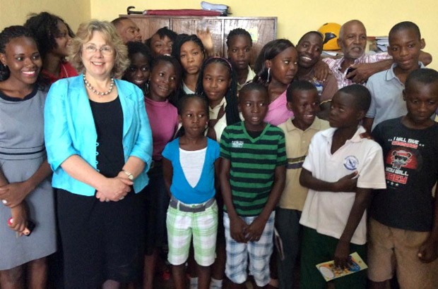 Baroness Northover poses with young children who create radio programmes aimed at ending child marriage. Picture: Baroness Northover