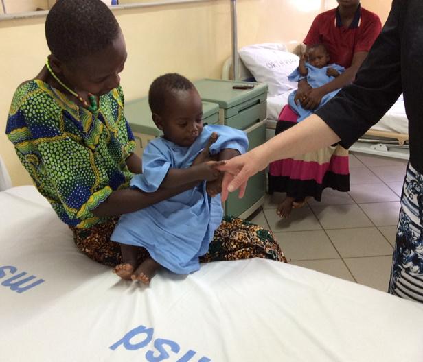 Baby Joshua on his mother's lap. Picture: DFID