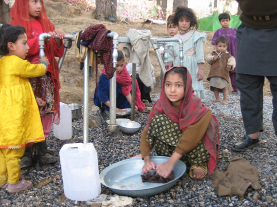 Nazima, 12, using UK-funded clean water in Kashmir Colony, Mansehra Pakistan. Picture: Leonard Tedd