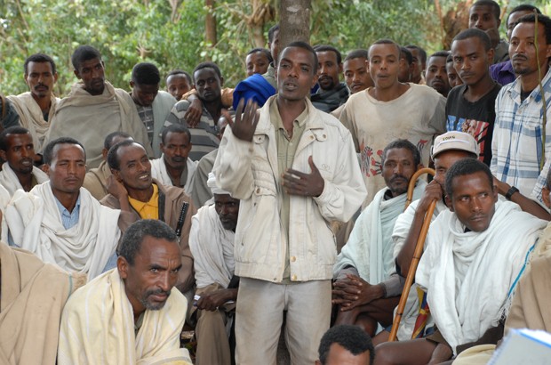 Men in a rural village in Amhara, Ethiopia, discuss gender equality on a course run by the Population Council. Picture: Ashenafi Tibebe/Girls Not Brides. All rights reserved.