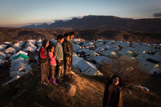 Children look out at the sunset over the Bamarne IDP camp in northern Iraq. Picture: Andrew McConnell/Panos for DFID